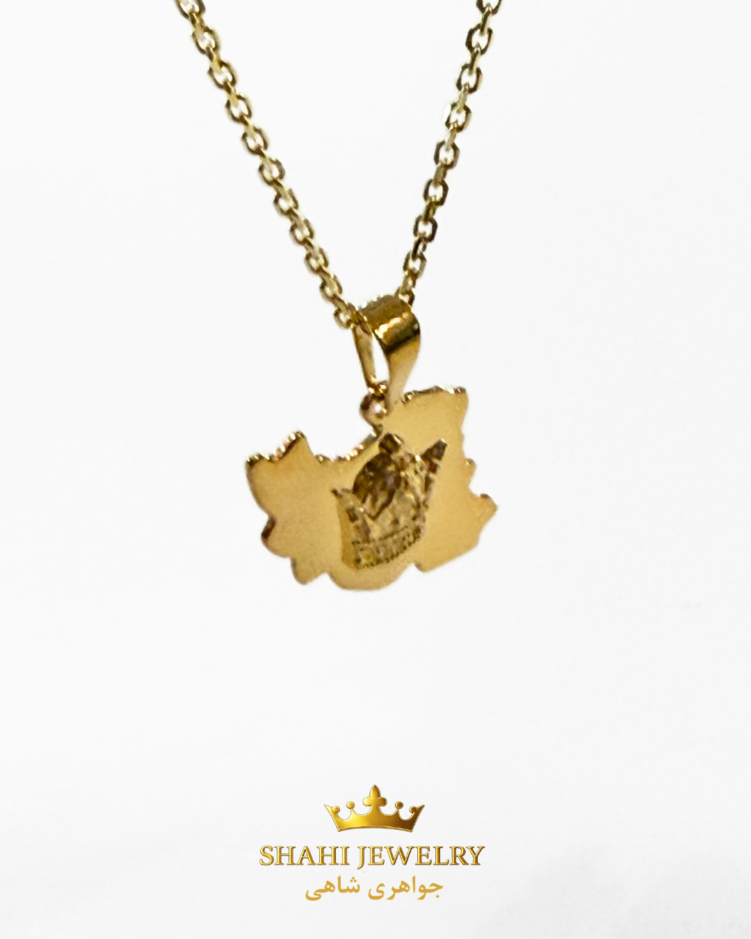 A gold pendant necklace featuring a map of Iran with a crown emblem