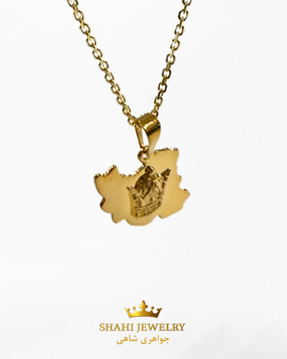 A gold pendant necklace featuring a map of Iran with a crown emblem