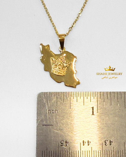 A gold pendant necklace featuring a map of Iran with a crown emblem