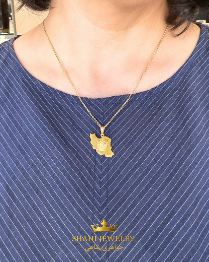 A gold pendant necklace featuring a map of Iran with a crown emblem